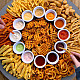 Overhead shot of a platter or various types of french fries and dipping sauces.